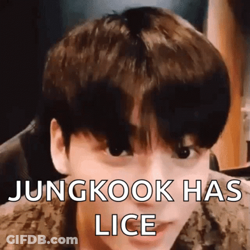 A Close Up Of A Young Man 'S Face With The Words Jungkook Has Lice Written On It . GIF