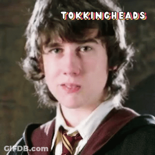 A Close Up Of A Young Man 'S Face With The Words Tockingheads Written Above Him GIF