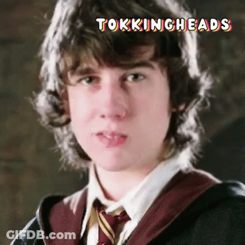 A Close Up Of A Young Man 'S Face With The Words Tockingheads Written Above Him GIF