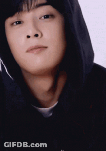 A Close Up Of A Young Man Wearing A Black Hoodie . GIF