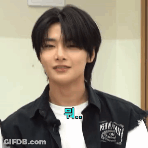 A Close Up Of A Young Man Wearing A Black Shirt And A White Shirt . GIF