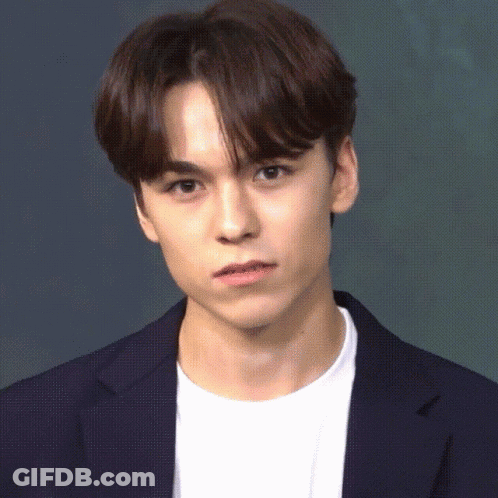 A Close Up Of A Young Man Wearing A Blue Jacket And White Shirt GIF