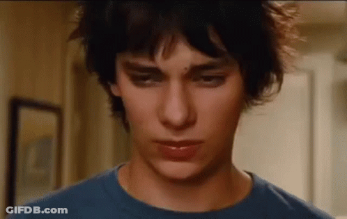A Close Up Of A Young Man Wearing A Blue Shirt . GIF