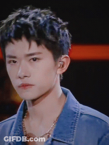 A Close Up Of A Young Man Wearing A Denim Jacket GIF