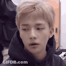 A Close Up Of A Young Man Wearing A Hoodie . GIF