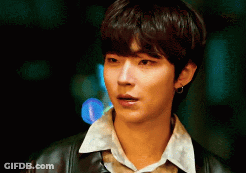 A Close Up Of A Young Man Wearing A Leather Jacket And A White Shirt GIF