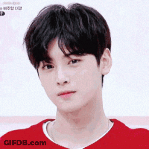 A Close Up Of A Young Man Wearing A Red Sweater . GIF