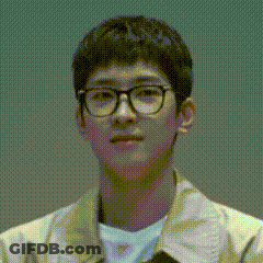 A Close Up Of A Young Man Wearing Glasses And A Jacket . GIF