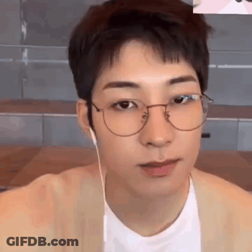A Close Up Of A Young Man Wearing Glasses And Headphones . GIF