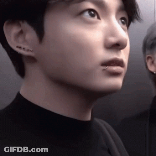 A Close Up Of A Young Man With A Piercing In His Lip . GIF