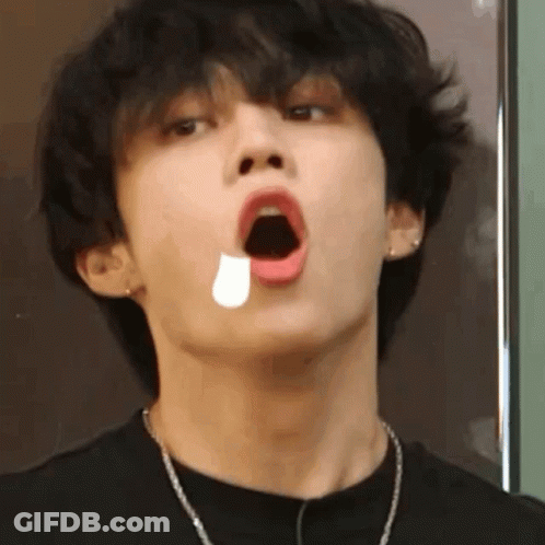 A Close Up Of A Young Man With His Mouth Open And A Tear Coming Out Of His Mouth . GIF