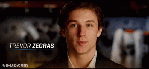 A Close Up Of A Young Man With The Name Trevor Zegras GIF