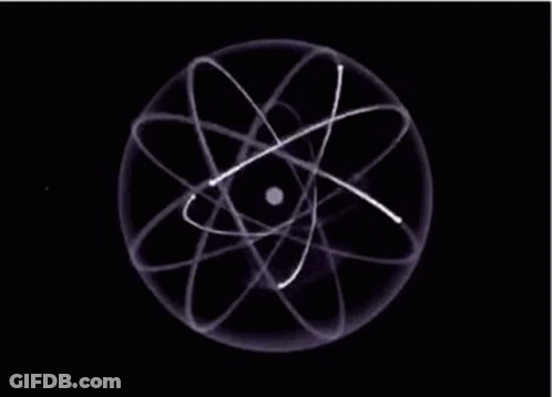 A Close Up Of An Atom With A Black Background And White Lines Around It . GIF