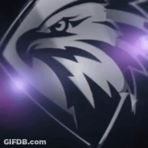 A Close Up Of An Eagle 'S Head On A Dark Background With Purple Lights Behind It . GIF