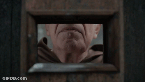 A Close Up Of An Elderly Man 'S Face With His Hand On His Mouth GIF
