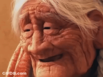 A Close Up Of An Elderly Woman 'S Face With Her Eyes Closed . GIF