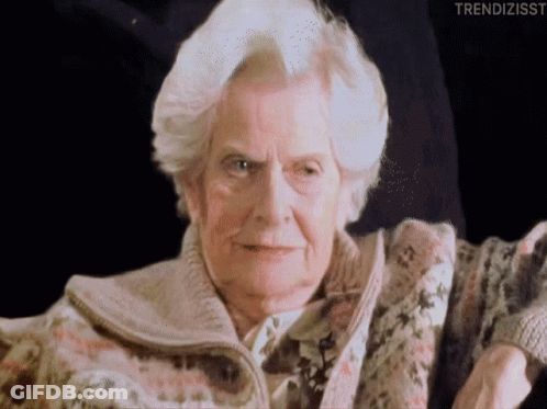 A Close Up Of An Elderly Woman 'S Face With The Words Trendizisst Written Below Her GIF