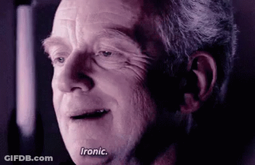 A Close Up Of An Older Man 'S Face With The Words `` Ironic '' Written On His Face . GIF