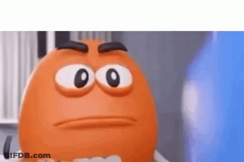 A Close Up Of An Orange Cartoon Character With Big Eyes And A Serious Face . GIF