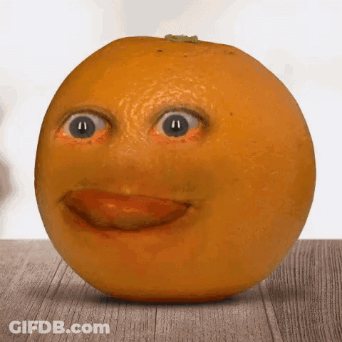 A Close Up Of An Orange With A Face On It GIF