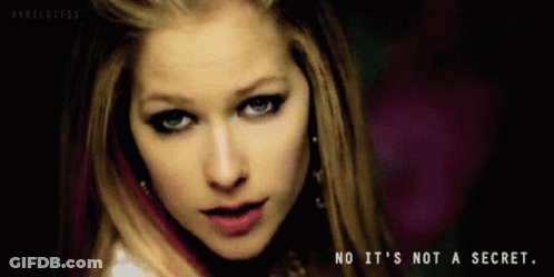 A Close Up Of Avril Lavigne With The Words No It 'S Not A Secret Below Her GIF