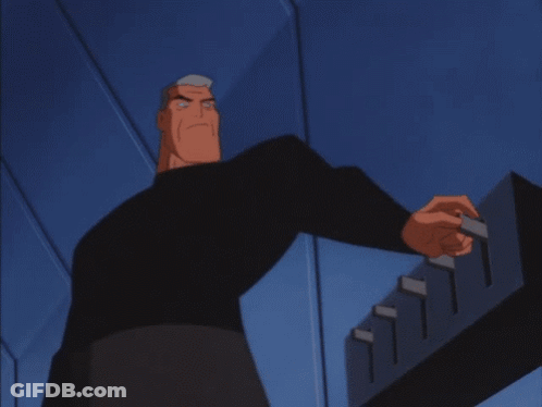 A Close Up Of Batman 'S Face With A Blue Background GIF