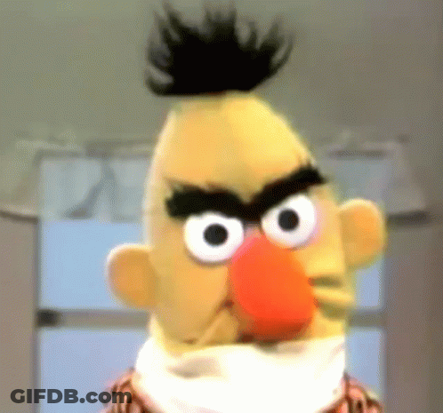 A Close Up Of Bert From Sesame Street With A Very Angry Look On His Face GIF