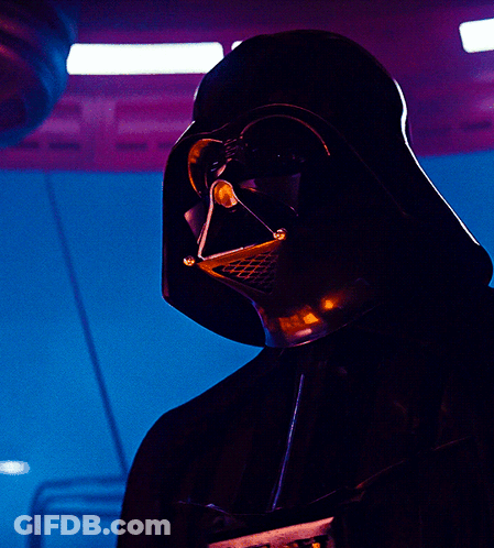 A Close Up Of Darth Vader 'S Face With A Blue Background GIF