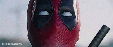 A Close Up Of Deadpool 'S Face With A Sword . GIF