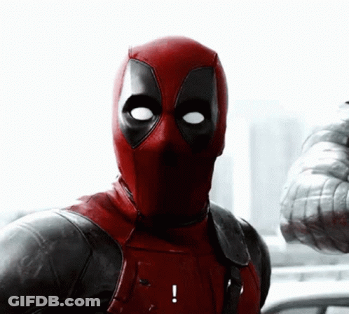 A Close Up Of Deadpool 'S Face With An Exclamation Mark GIF