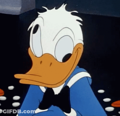 A Close Up Of Donald Duck Wearing A Blue Shirt And Bow Tie GIF