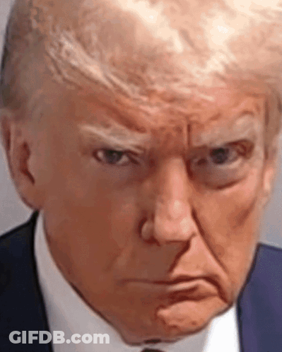 A Close Up Of Donald Trump 'S Face In A Suit And Tie Making An Angry Face . GIF