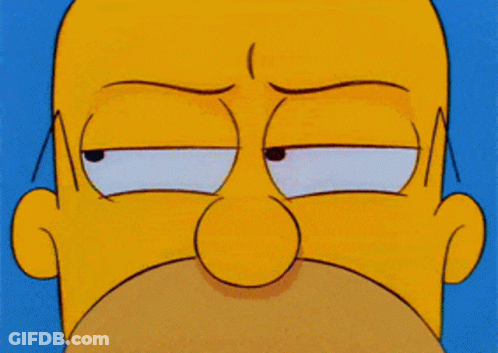 A Close Up Of Homer Simpson 'S Face With An Angry Look On His Face GIF