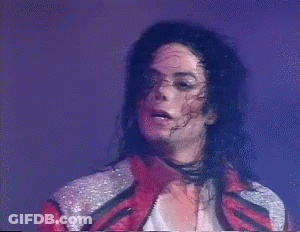 A Close Up Of Michael Jackson 'S Face With A Purple Background GIF
