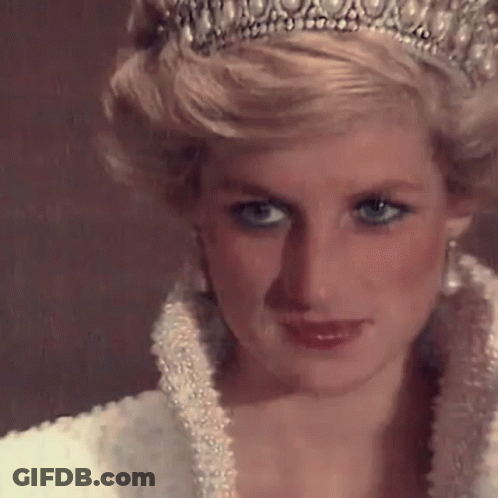 A Close Up Of Princess Diana Wearing A Tiara And A White Dress . GIF