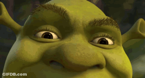 A Close Up Of Shrek 'S Face And Eyes GIF