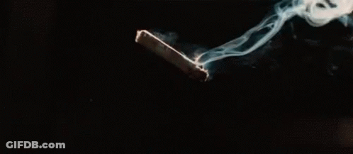 A Close Up Of Smoke Coming Out Of A Match On A Black Background . GIF