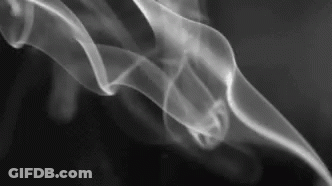 A Close Up Of Smoke Coming Out Of A Pipe On A Black Background . GIF