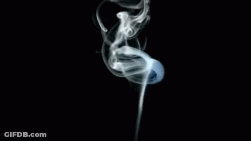 A Close Up Of Smoke Coming Out Of A Pipe On A Black Background GIF