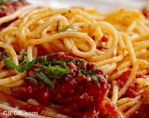 A Close Up Of Spaghetti With Tomato Sauce And Meatballs GIF