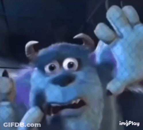 A Close Up Of Sulley From Monsters Inc Making A Scary Face . GIF