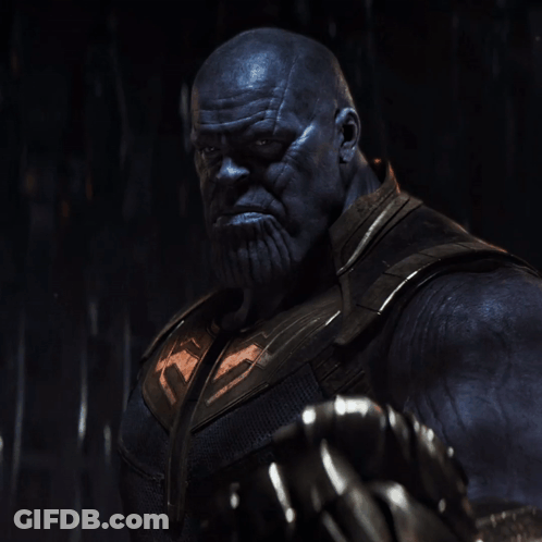 A Close Up Of Thanos With A Beard And Gloves GIF