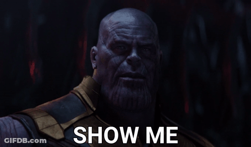 A Close Up Of Thanos With The Words Show Me Above Him GIF
