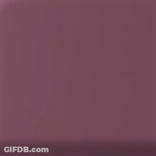 A Close Up Of The Back Of A Pink Cell Phone GIF