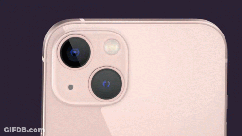 A Close Up Of The Back Of An Iphone With A Pink Screen GIF