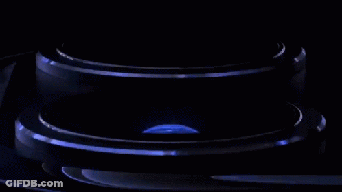 A Close Up Of The Camera Lens Of A Cell Phone Against A Black Background . GIF