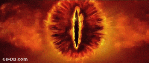 A Close Up Of The Eye Of Sauron From The Lord Of The Rings Surrounded By Flames . GIF