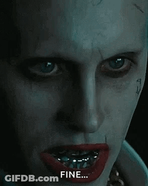 A Close Up Of The Face Of The Joker From The Movie Suicide Squad With Braces On His Teeth . GIF