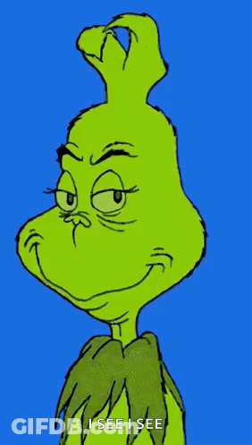 A Close Up Of The Grinch 'S Face With The Words `` I See I See '' Written Below It . GIF