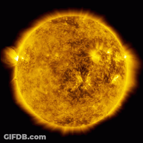 A Close Up Of The Sun With A Dark Background GIF